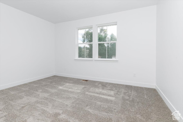 195 West 300 North Logan, UT 84321 - Photo 19 of 20 Carpeted spare room featuring baseboards