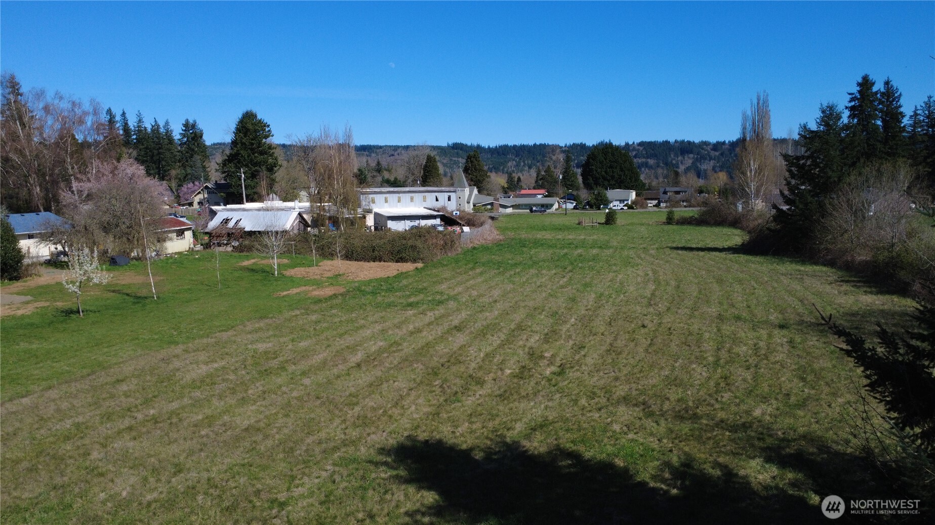 29438 Highway 101 Quilcene, WA 98376 - Photo 3 of 8 a view of a town with barn house in the background