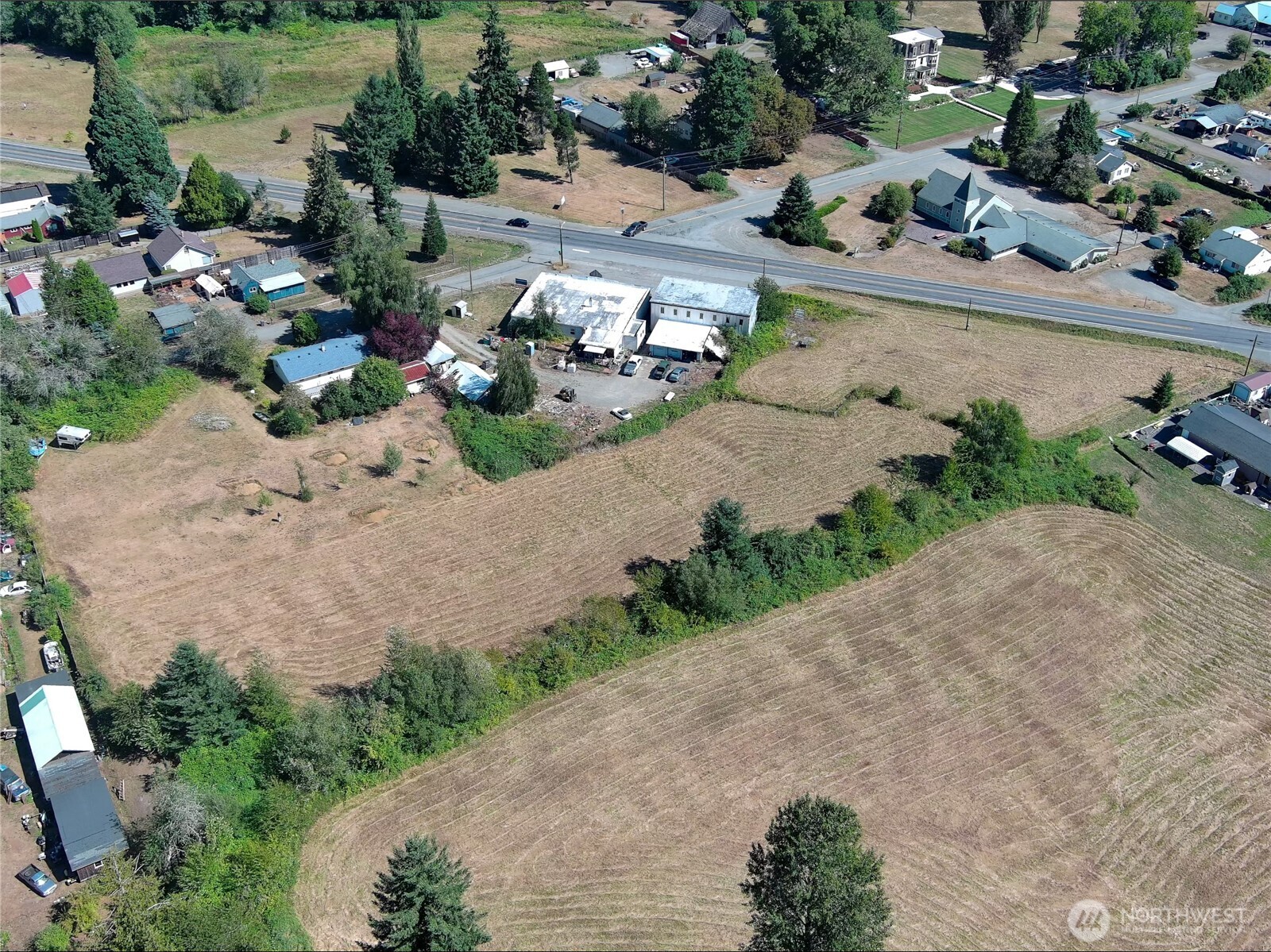 29438 Highway 101 Quilcene, WA 98376 - Photo 5 of 8 an aerial view of a house with a yard and lake view