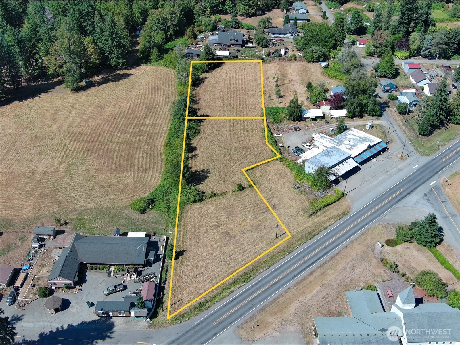 29438 Highway 101 Quilcene, WA 98376 - Photo 6 of 8 an aerial view of a house with a garden