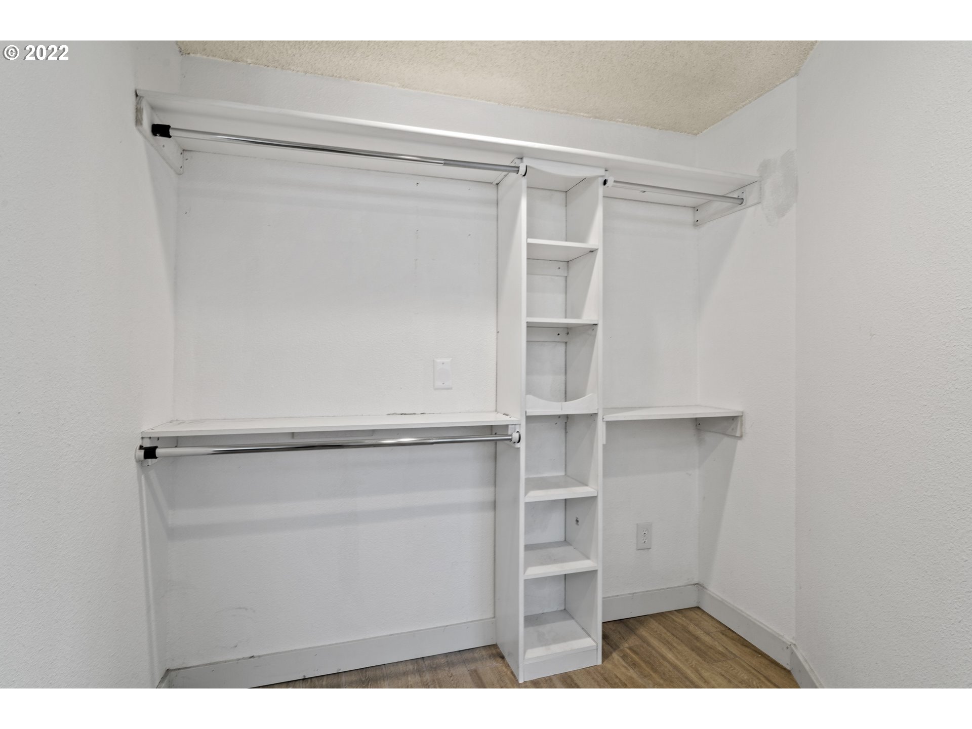 13644 Agate Road Eagle Point, OR 97524 - Photo 16 of 32 a view of walk in closet with empty racks