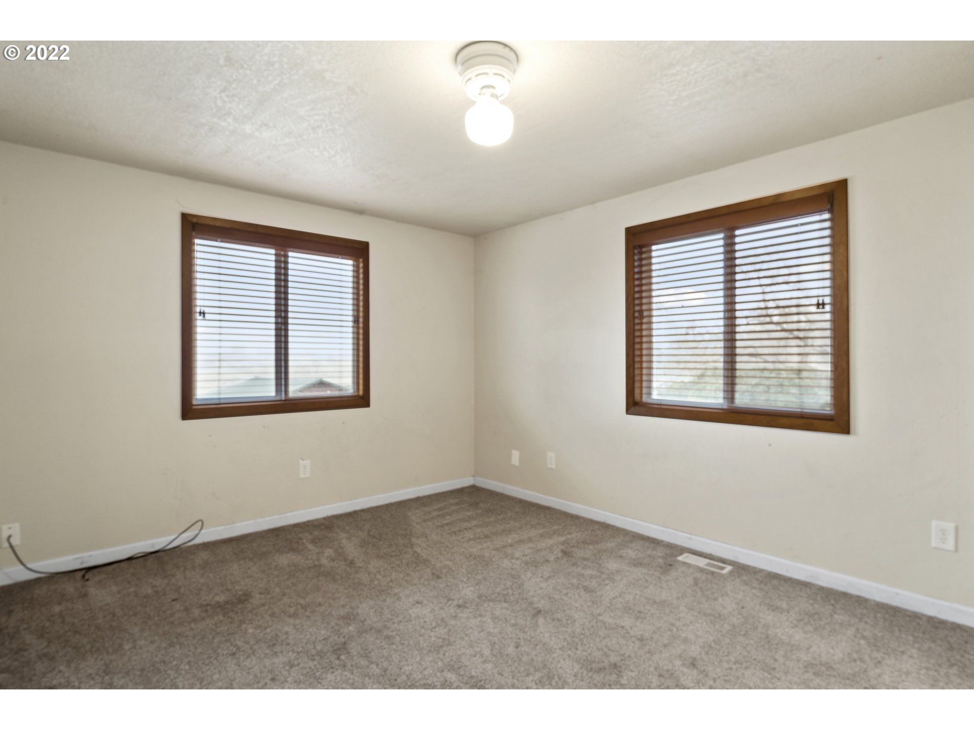 13644 Agate Road Eagle Point, OR 97524 - Photo 8 of 32 a view of an empty room with a window