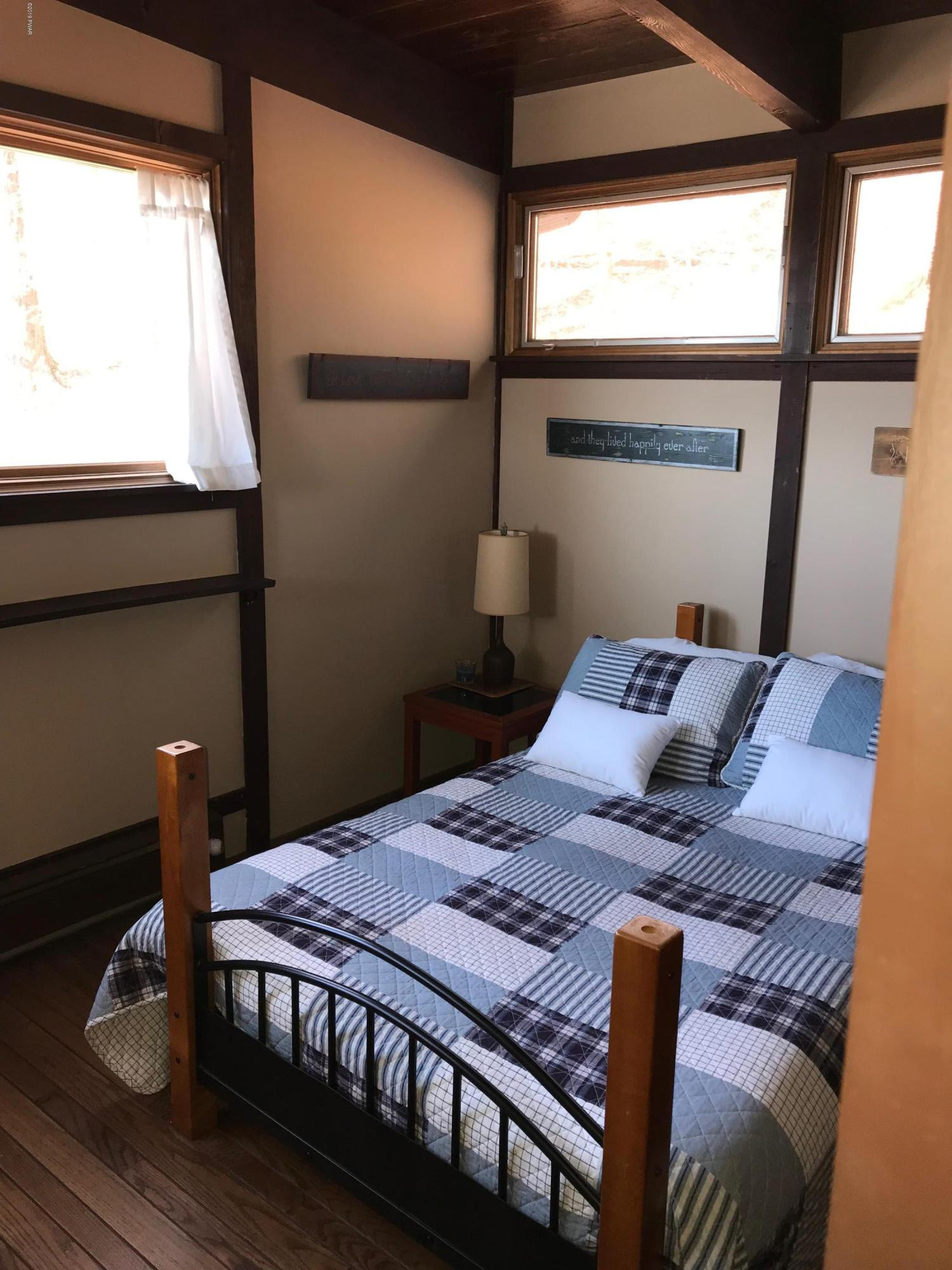819 Wargo Road Union Dale, PA 18470 - Photo 24 of 49 a bedroom with a bed and window