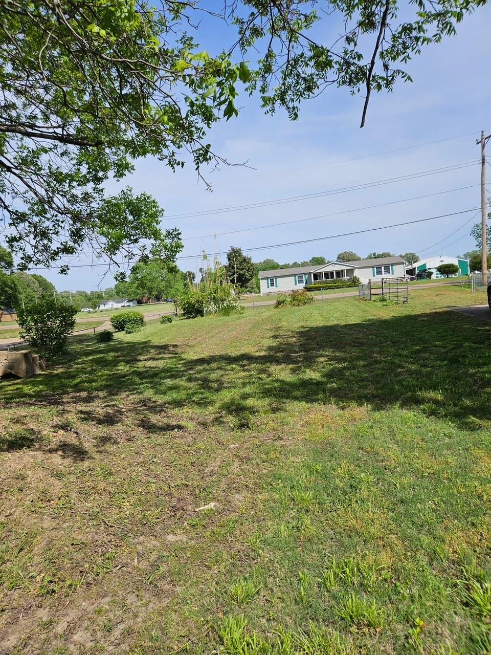 7647 Sledge Road Millington, TN 38053 - Photo 5 of 5 a view of a field with an trees