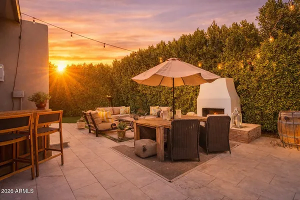 a view of backyard of house with seating space