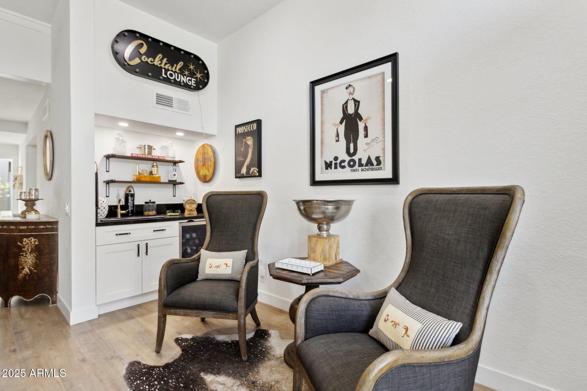 216 West Winged Foot Road Phoenix, AZ 85023 - Photo 9 of 55 a living room with furniture and a chair