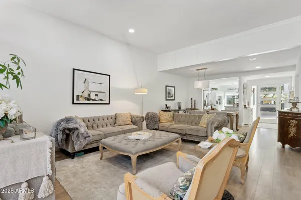 a living room with furniture and a chair