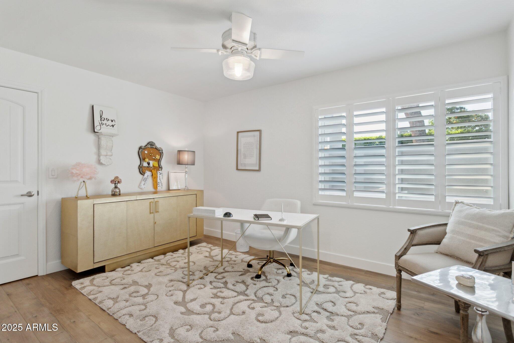216 West Winged Foot Road Phoenix, AZ 85023 - Photo 21 of 55 a view of a workspace with furniture and a window