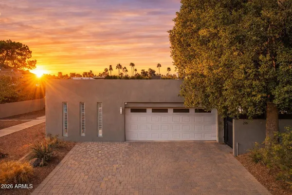 a terrace of a house with outdoor seating