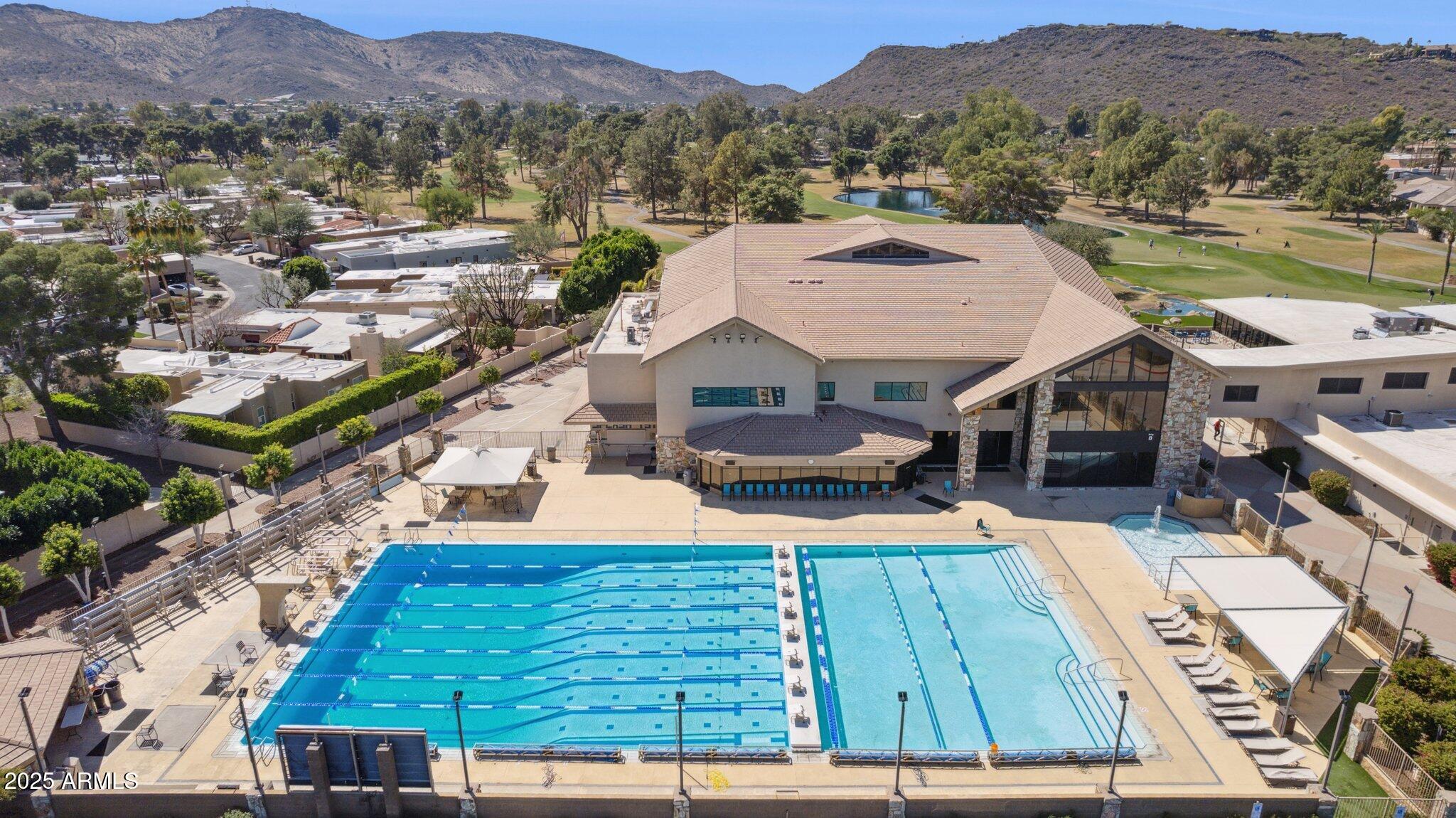 216 West Winged Foot Road Phoenix, AZ 85023 - Photo 48 of 55 an aerial view of a house with pool and mountain view
