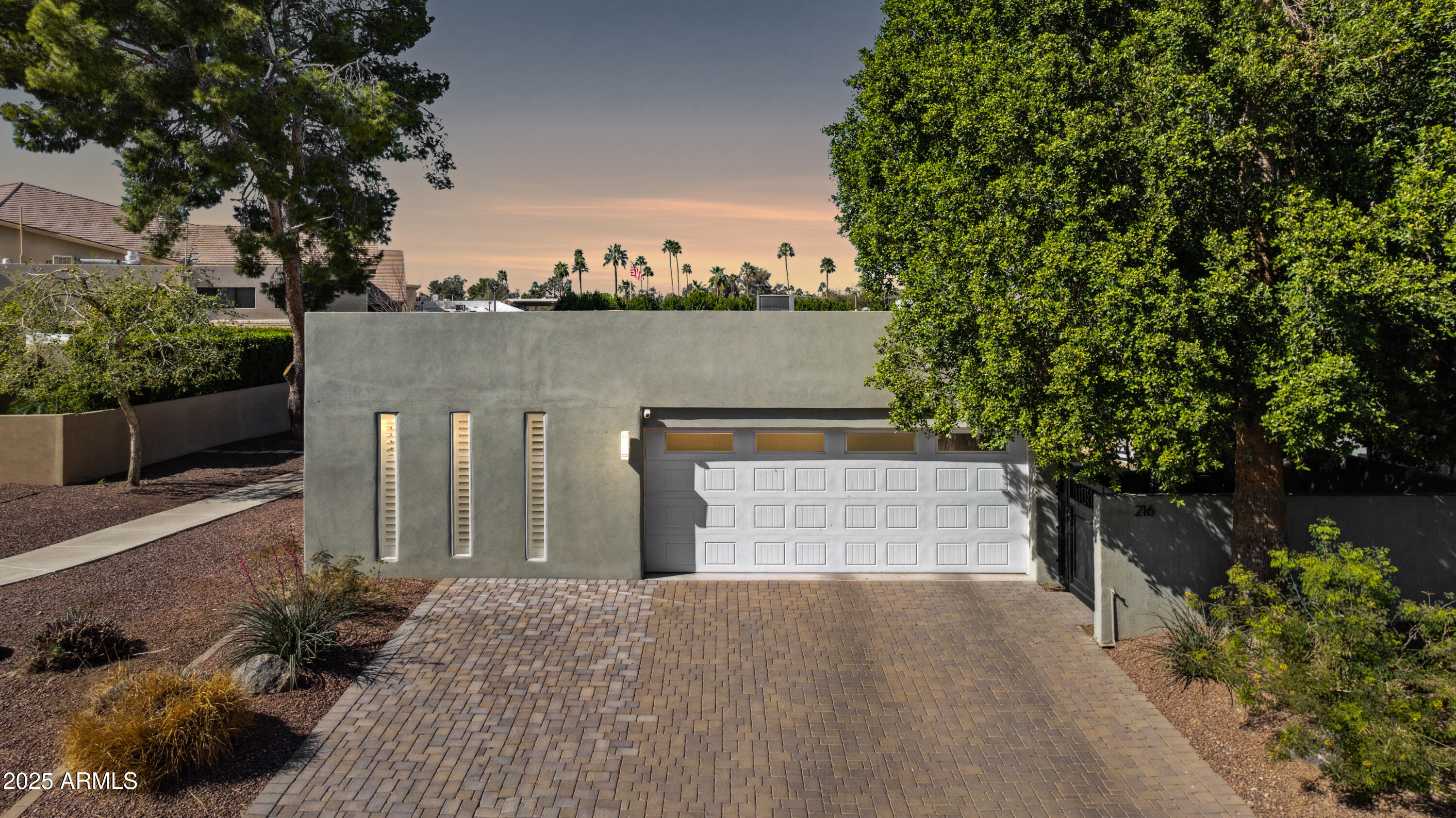 216 West Winged Foot Road Phoenix, AZ 85023 - Photo 49 of 55 a front view of a house with a yard and tree s