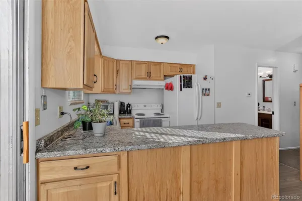 a kitchen with a stove and a microwave