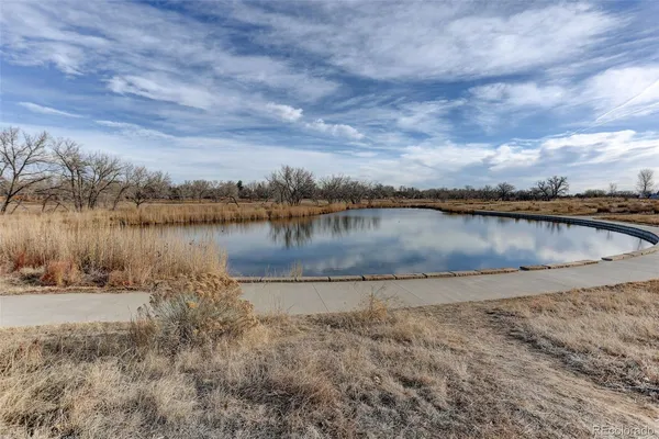 a living room with furniture and stairs