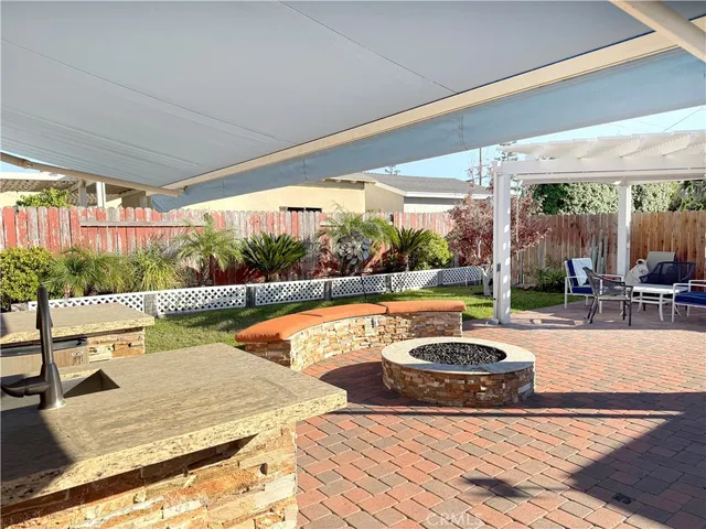a view of swimming pool with outdoor seating and plants