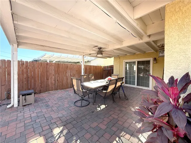 a view of a patio with couches table and chairs