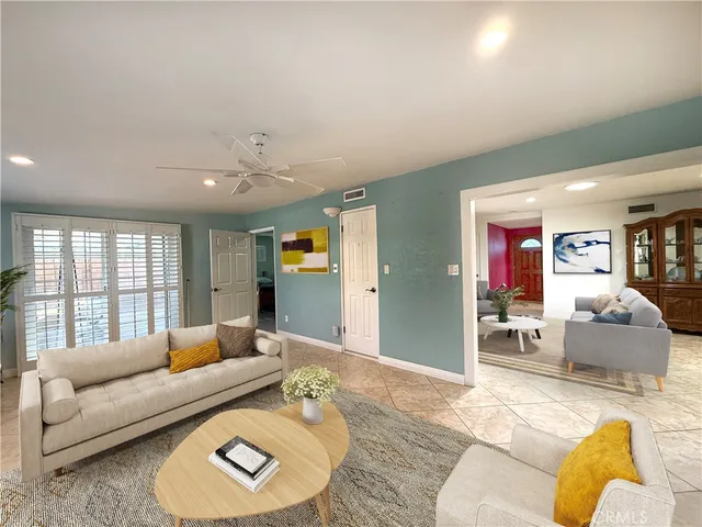 a living room with furniture and a large window