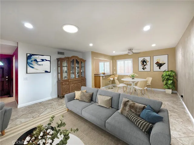 a living room with furniture and a rug