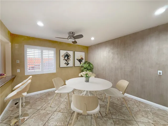 a view of a dining room with furniture and window
