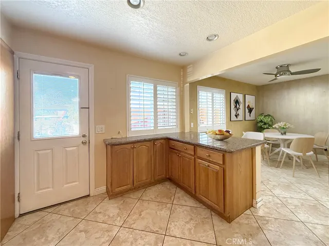 a kitchen with stainless steel appliances granite countertop a sink and cabinets