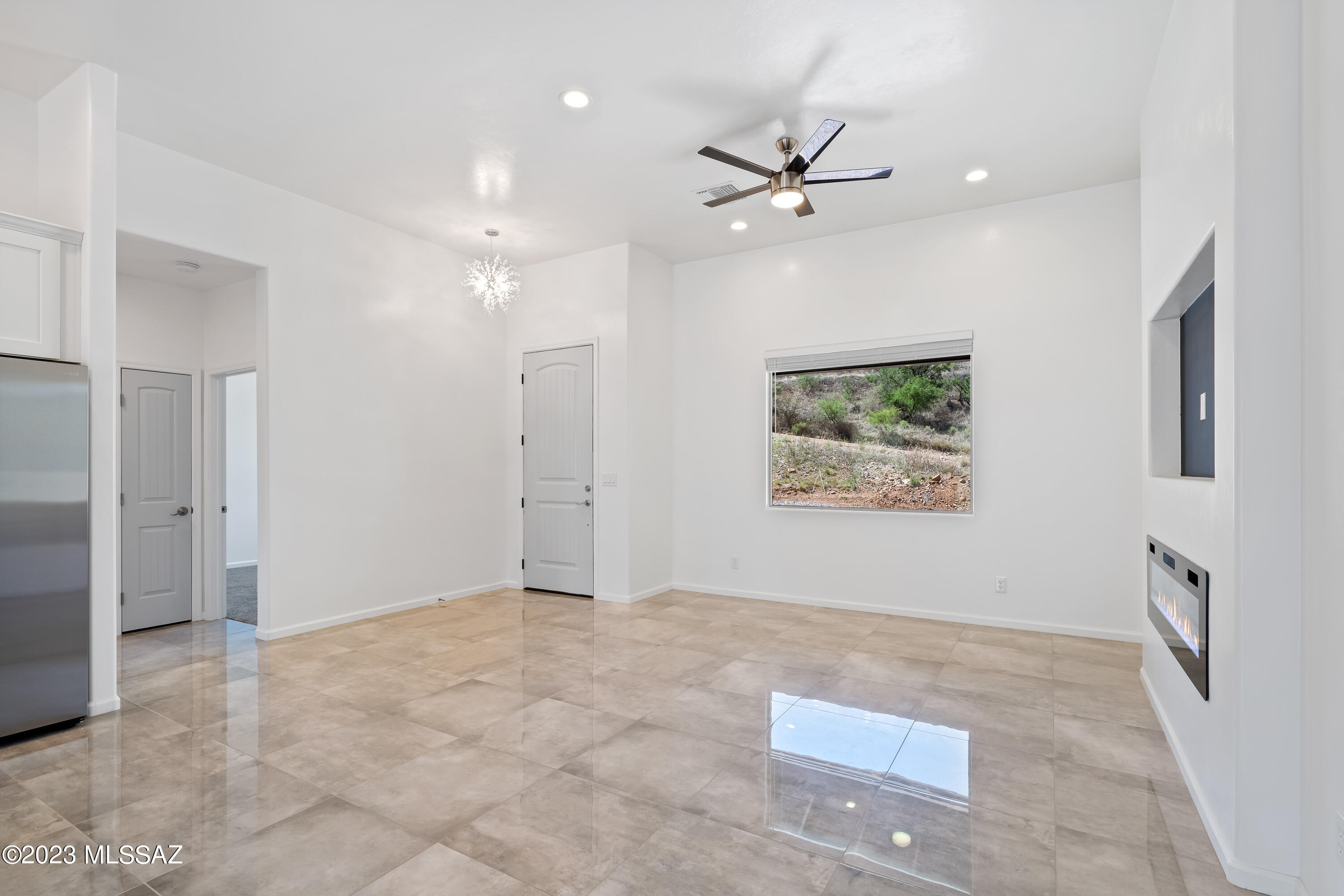 294 Circulo Cerro Rio Rico, AZ 85648 - Photo 7 of 38 a view of an empty room with a fan