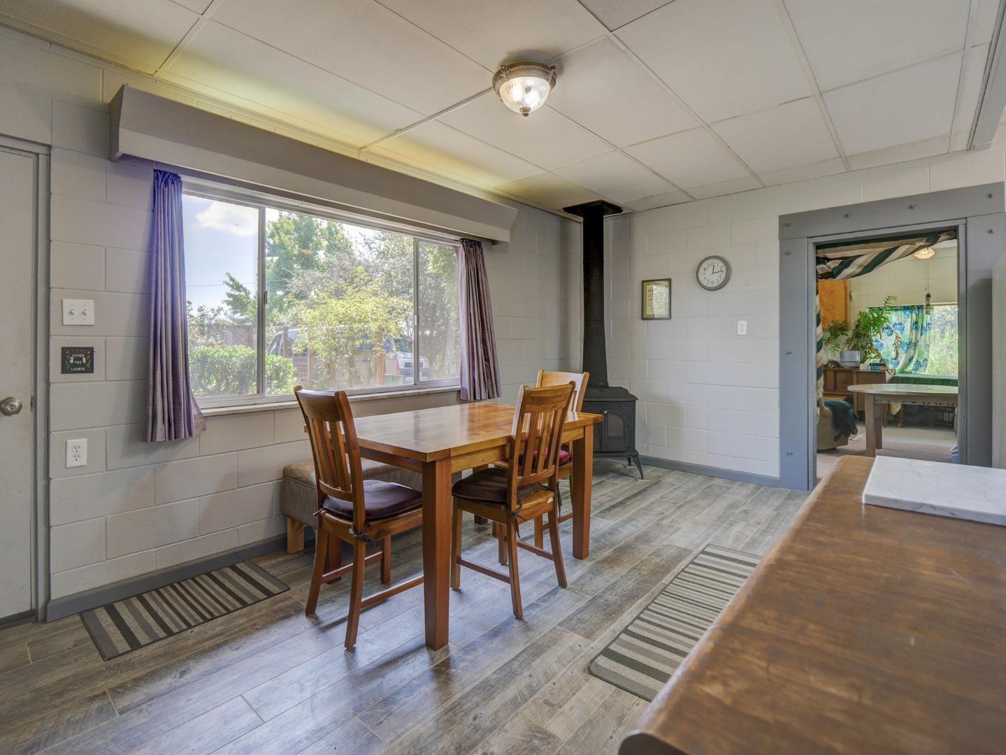 770 Calabasas Road Watsonville, CA 95076 - Photo 16 of 39 a view of a dining room with furniture window and wooden floor