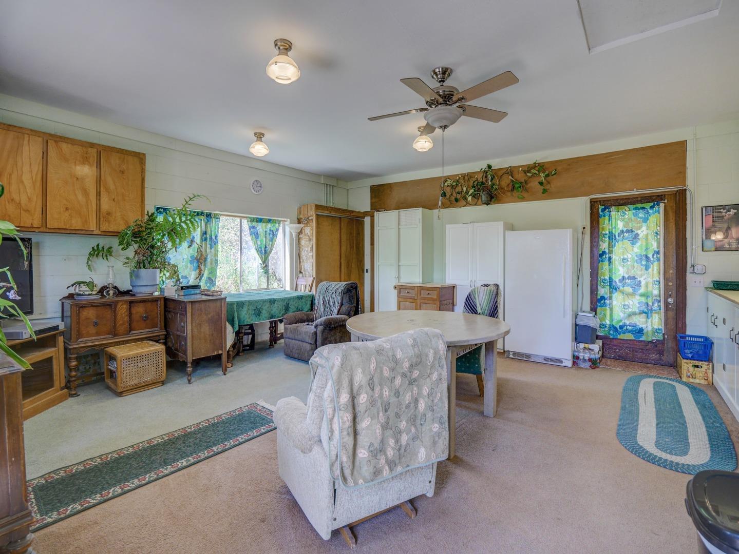 770 Calabasas Road Watsonville, CA 95076 - Photo 19 of 39 a living room with furniture and a large window