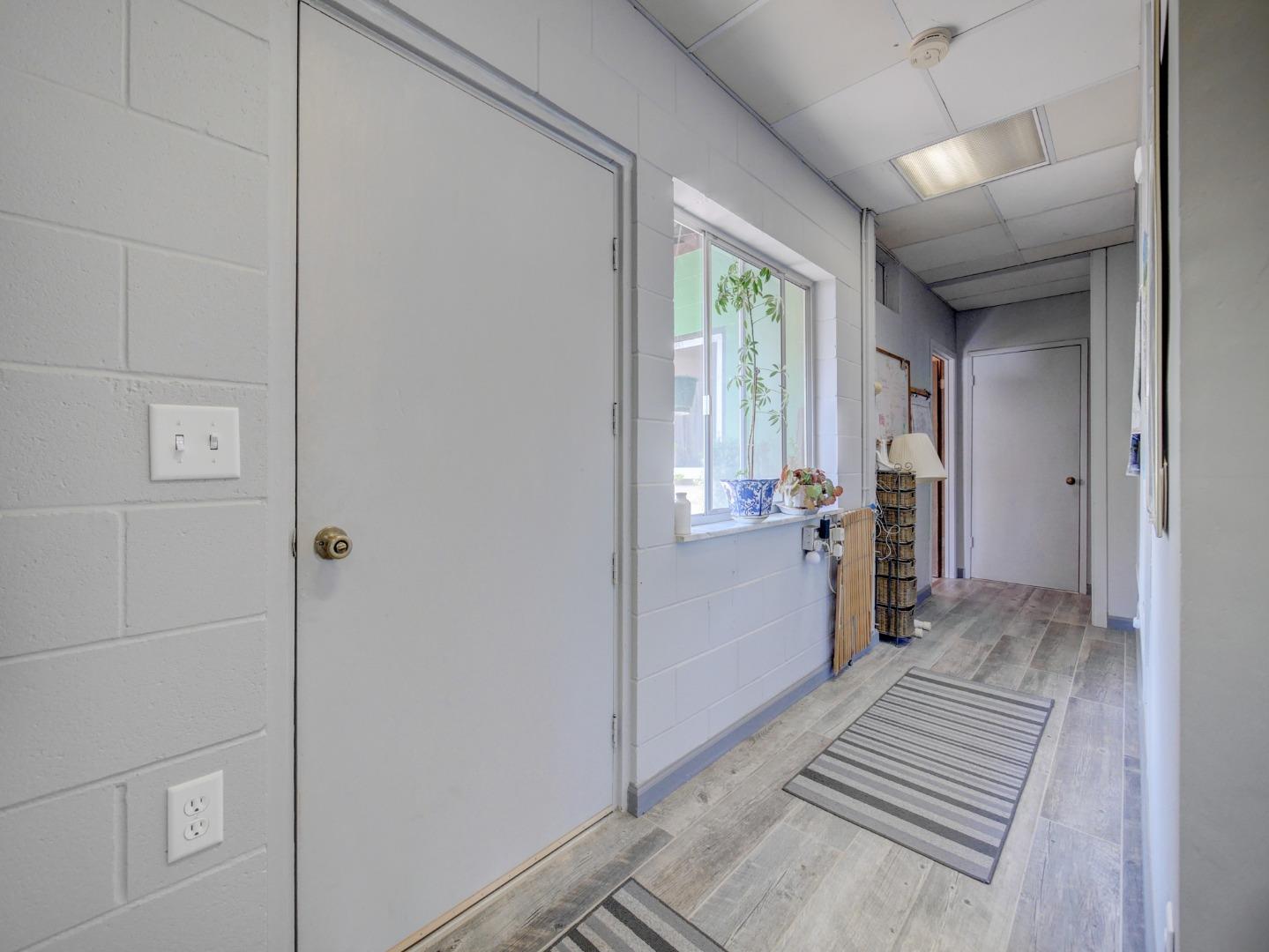 770 Calabasas Road Watsonville, CA 95076 - Photo 23 of 39 a view of a hallway with a bathroom