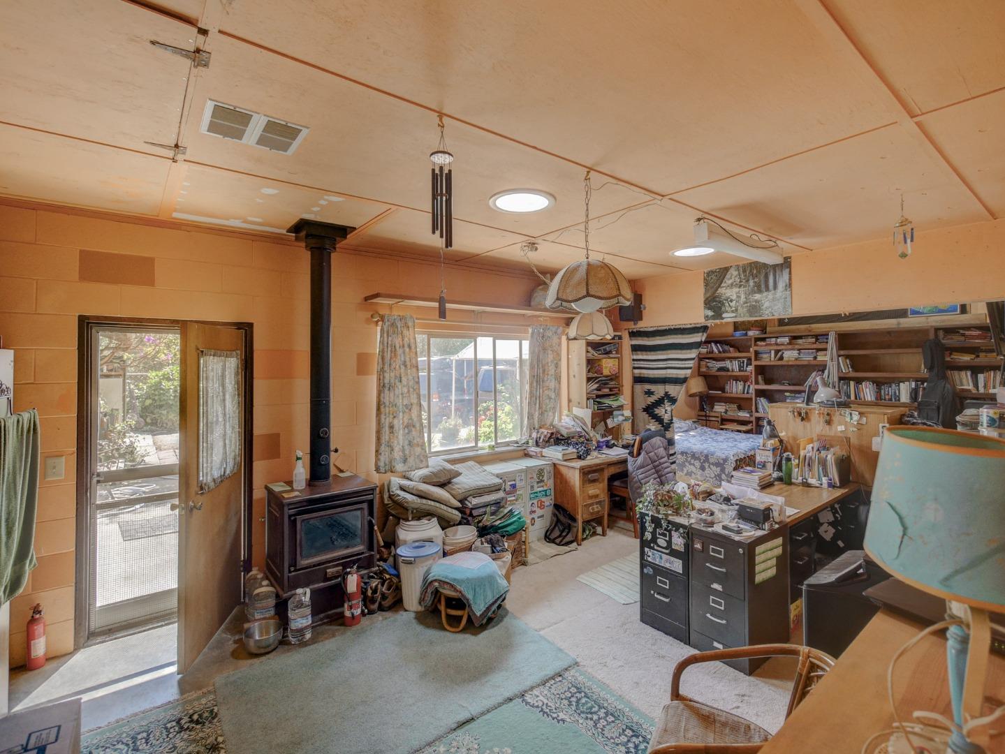 770 Calabasas Road Watsonville, CA 95076 - Photo 25 of 39 a living room with lots of furniture and a chandelier