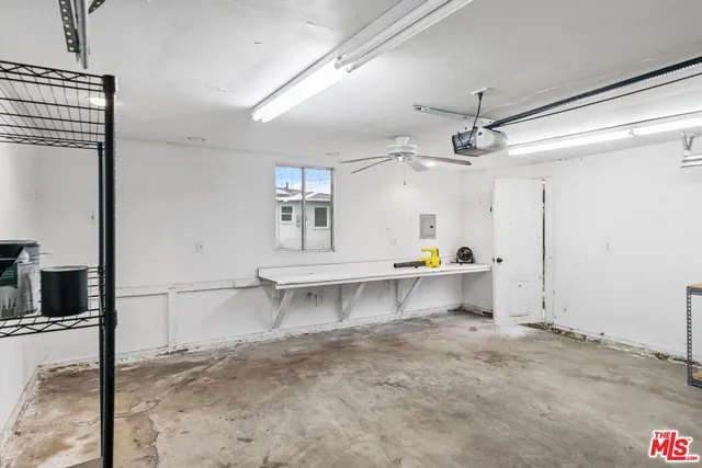 a view of a kitchen with a sink and cabinets