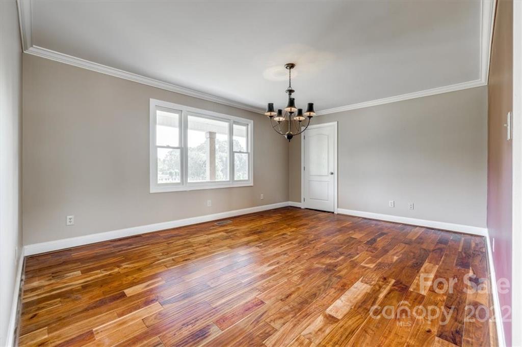 5249 Willow Pond Road Lake Wylie, SC 29710 - Photo 27 of 45 wooden floor in an empty room with a window