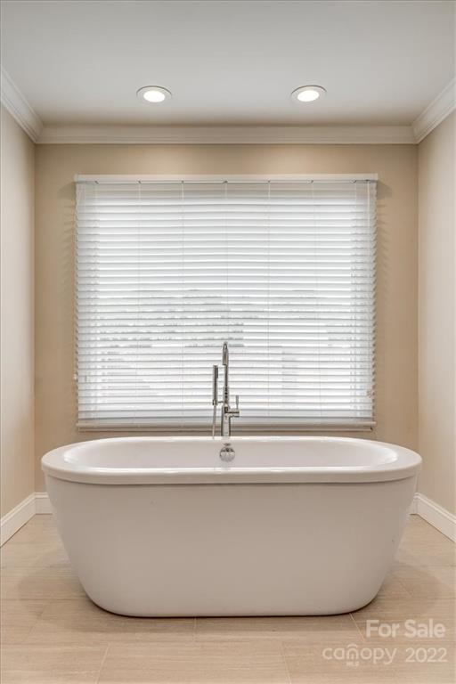 5249 Willow Pond Road Lake Wylie, SC 29710 - Photo 32 of 45 a white bath tub sitting in a bathroom next to a window