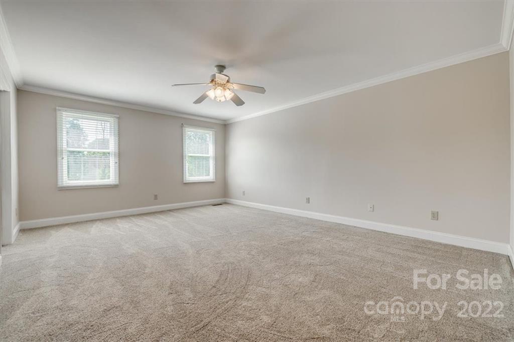5249 Willow Pond Road Lake Wylie, SC 29710 - Photo 33 of 45 an empty room with windows and ceiling fan
