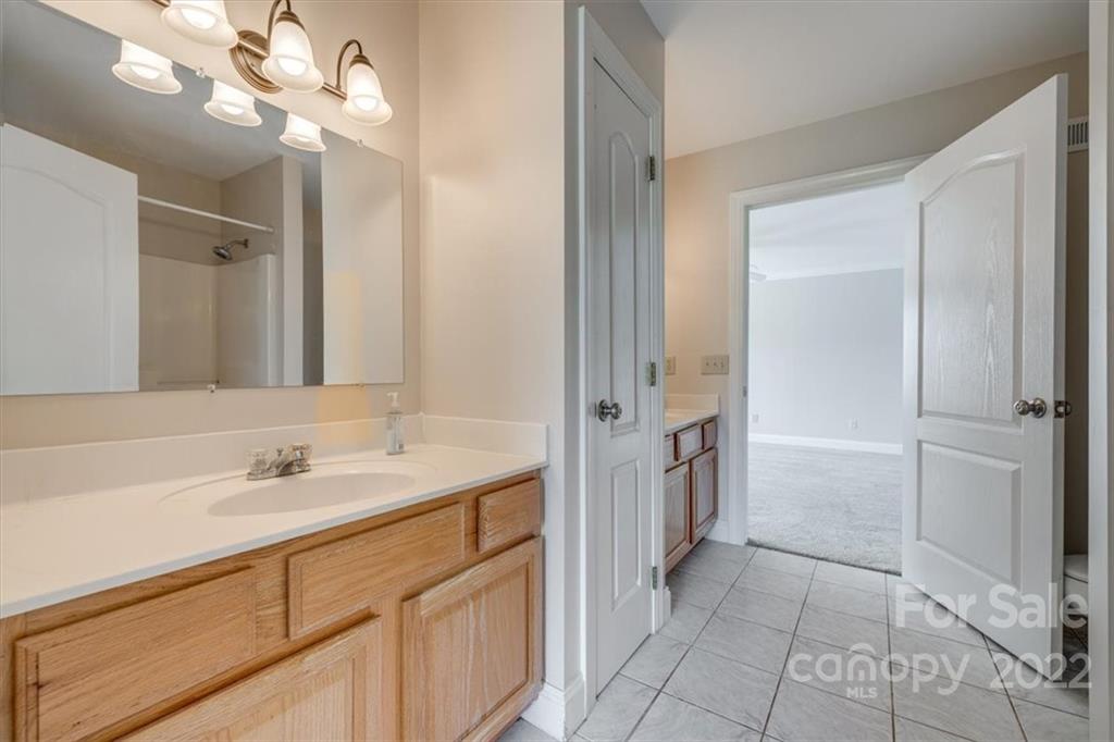 5249 Willow Pond Road Lake Wylie, SC 29710 - Photo 34 of 45 a bathroom with a sink a vanity and a mirror