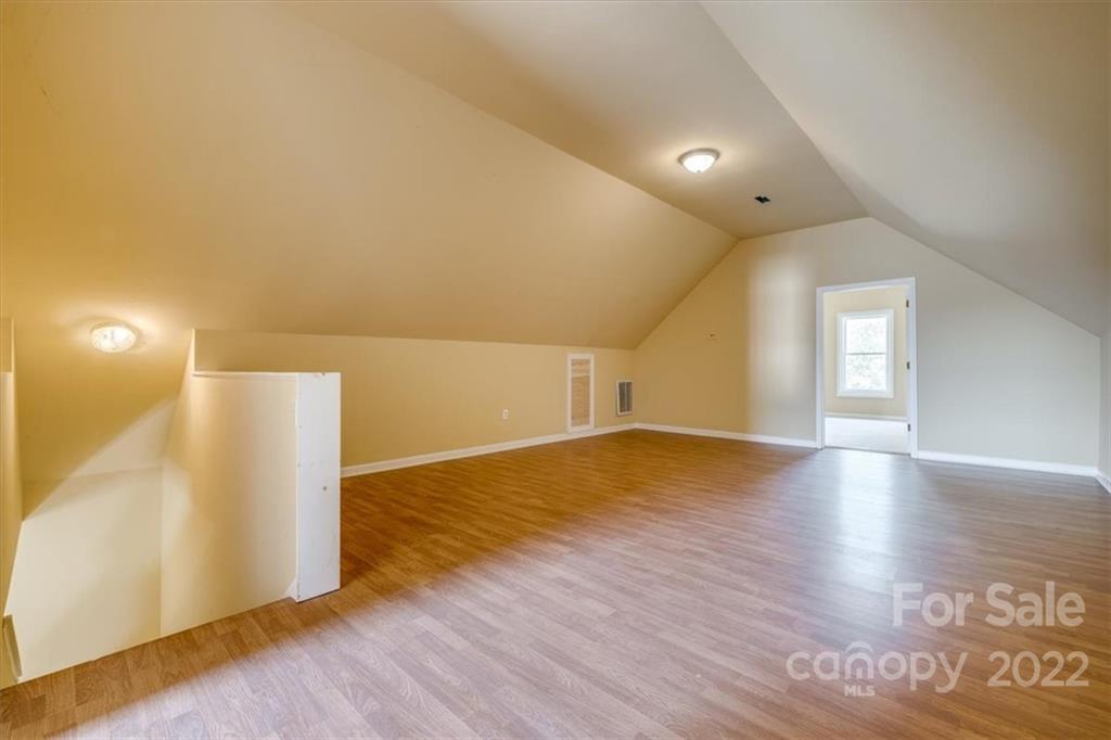 5249 Willow Pond Road Lake Wylie, SC 29710 - Photo 44 of 45 a view of empty room with wooden floor