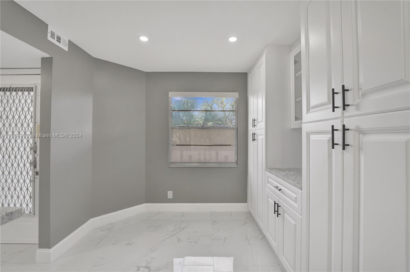 1802 Eleuthera Point, Unit E3 Coconut Creek, FL 33066 - Photo 12 of 78 a view of an empty room with a window