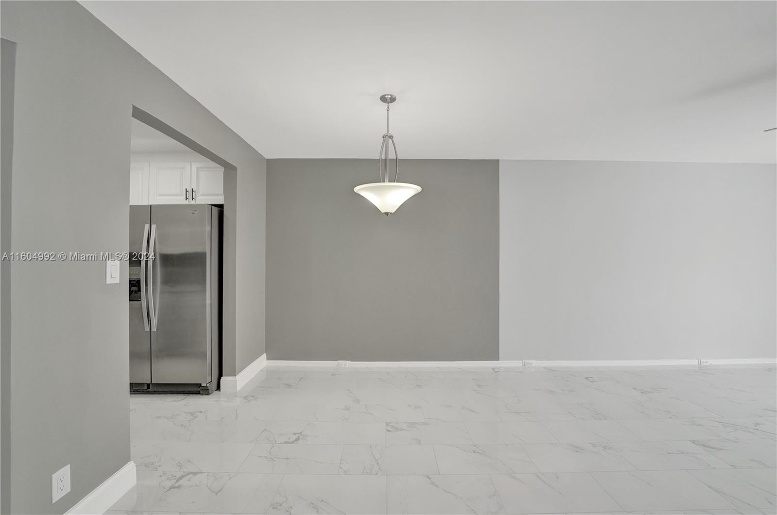 1802 Eleuthera Point, Unit E3 Coconut Creek, FL 33066 - Photo 23 of 78 a view of a room with a ceiling fan