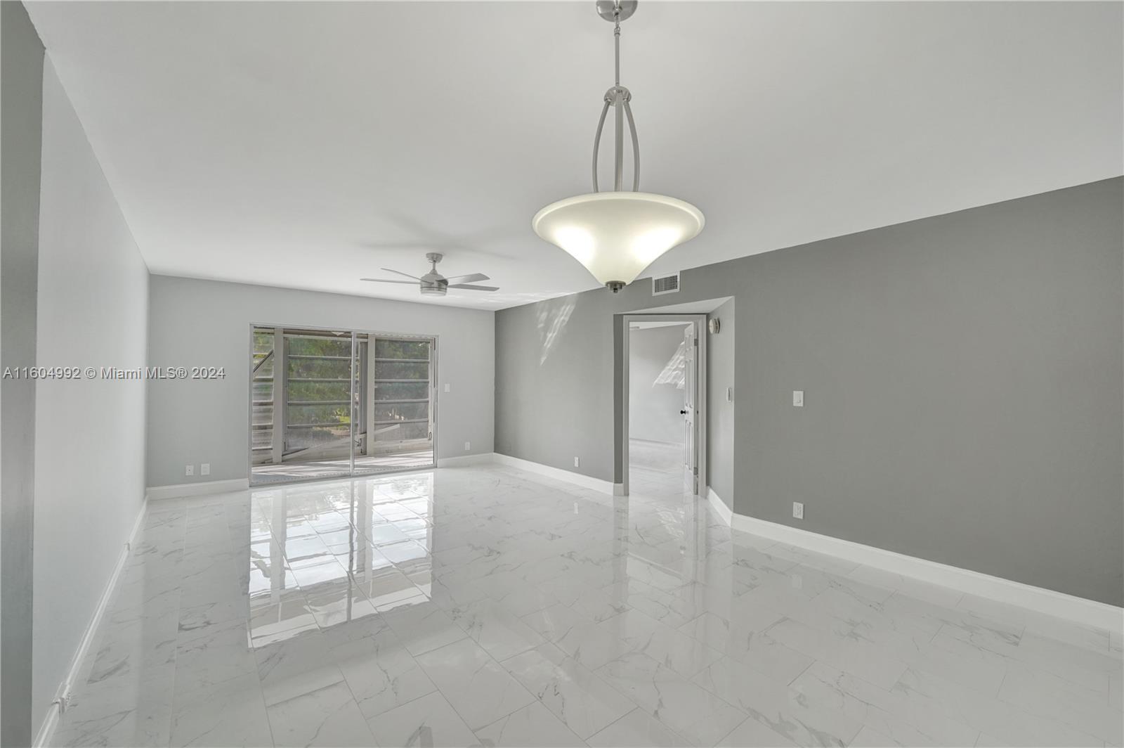 1802 Eleuthera Point, Unit E3 Coconut Creek, FL 33066 - Photo 24 of 78 a view of an empty room with a window