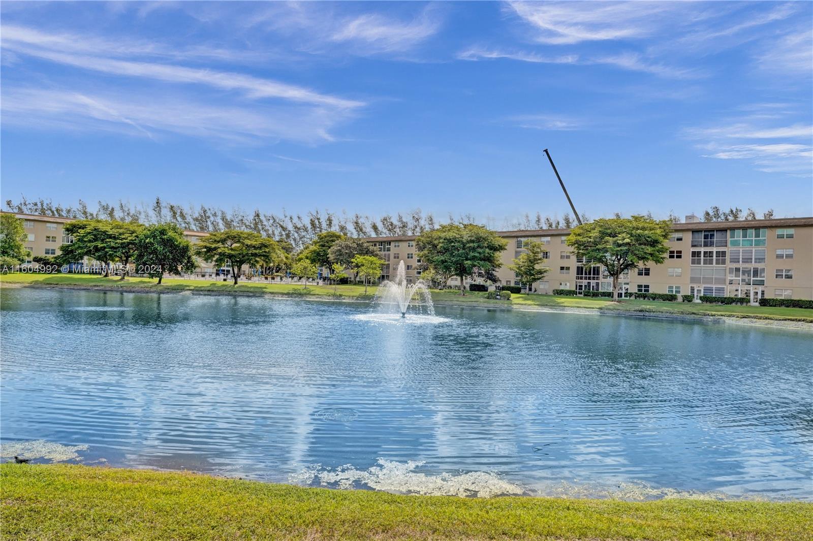 1802 Eleuthera Point, Unit E3 Coconut Creek, FL 33066 - Photo 43 of 78 a view of a lake with a big yard