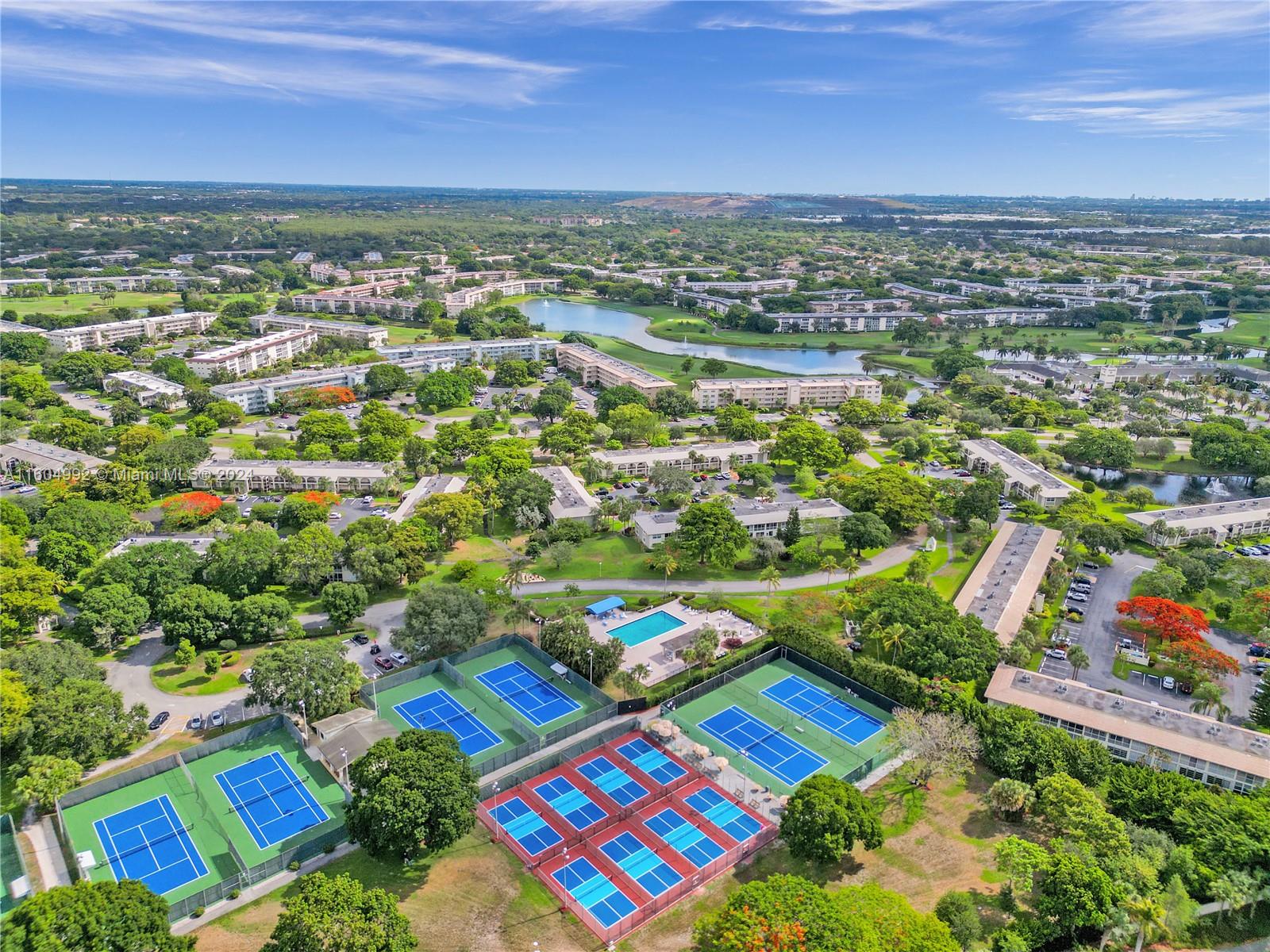 1802 Eleuthera Point, Unit E3 Coconut Creek, FL 33066 - Photo 50 of 78 an aerial view of residential houses with outdoor space