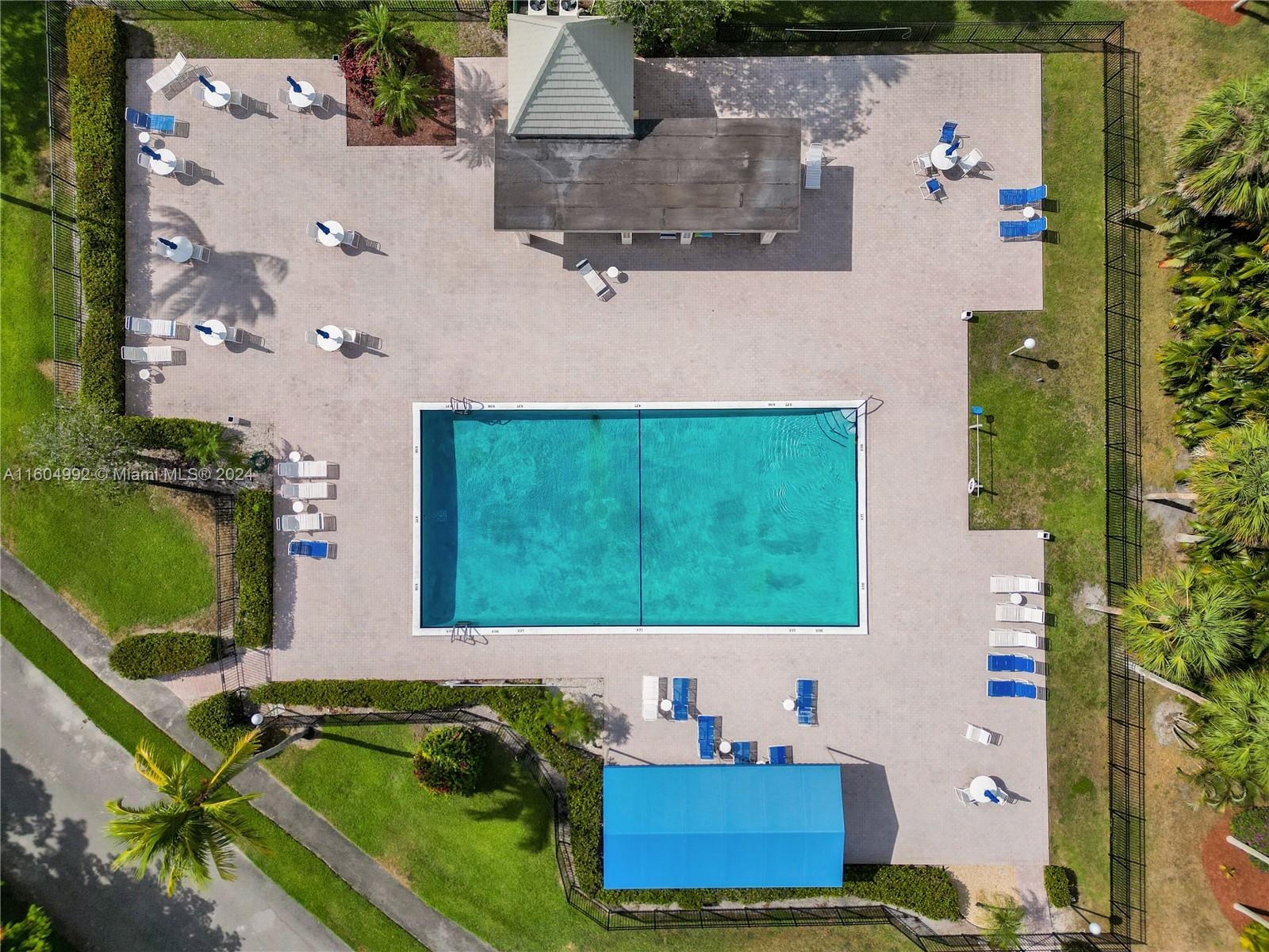 1802 Eleuthera Point, Unit E3 Coconut Creek, FL 33066 - Photo 55 of 78 an aerial view of a house with a yard basket ball court and outdoor seating