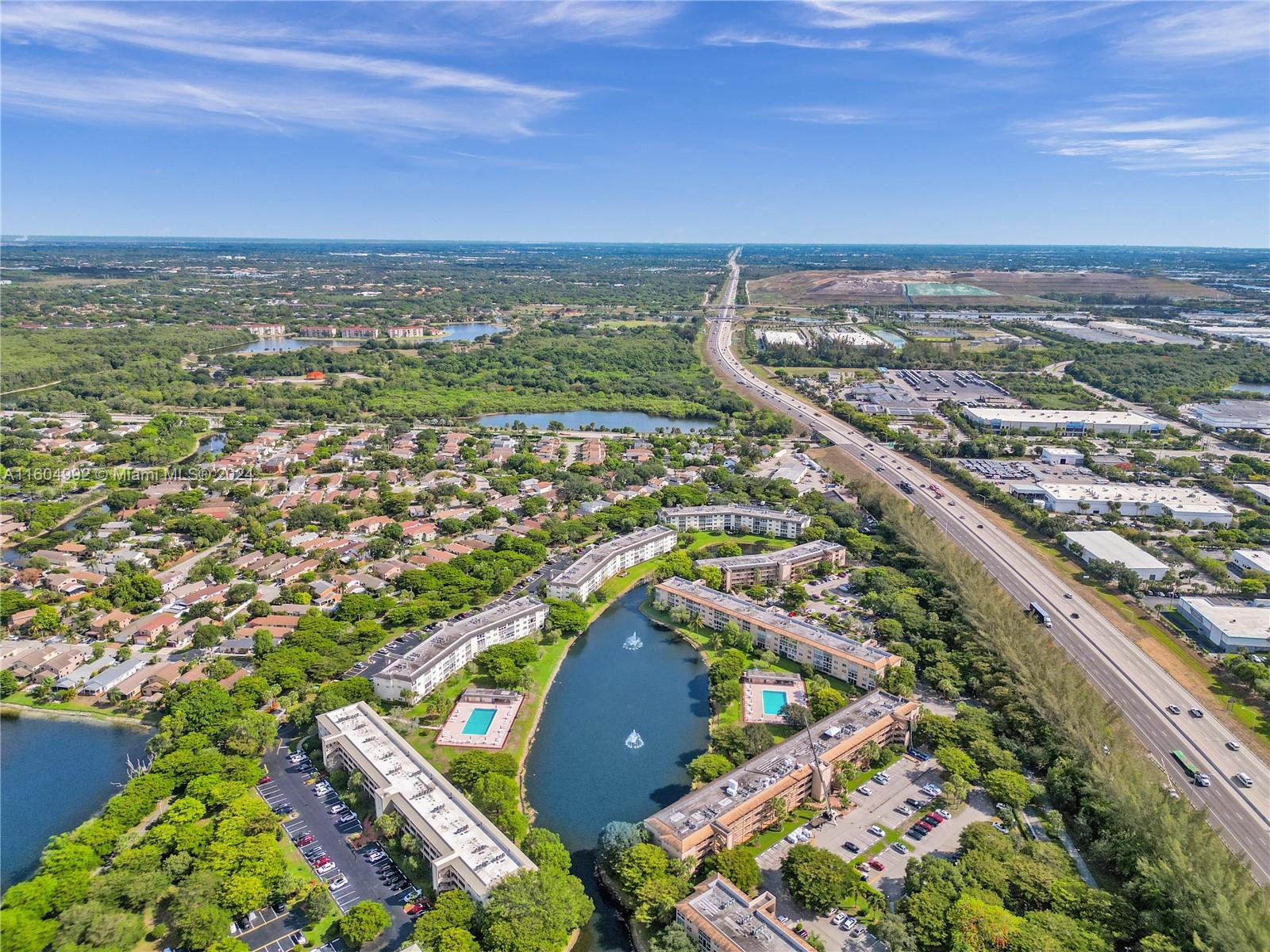 1802 Eleuthera Point, Unit E3 Coconut Creek, FL 33066 - Photo 71 of 78 an aerial view of residential building and ocean