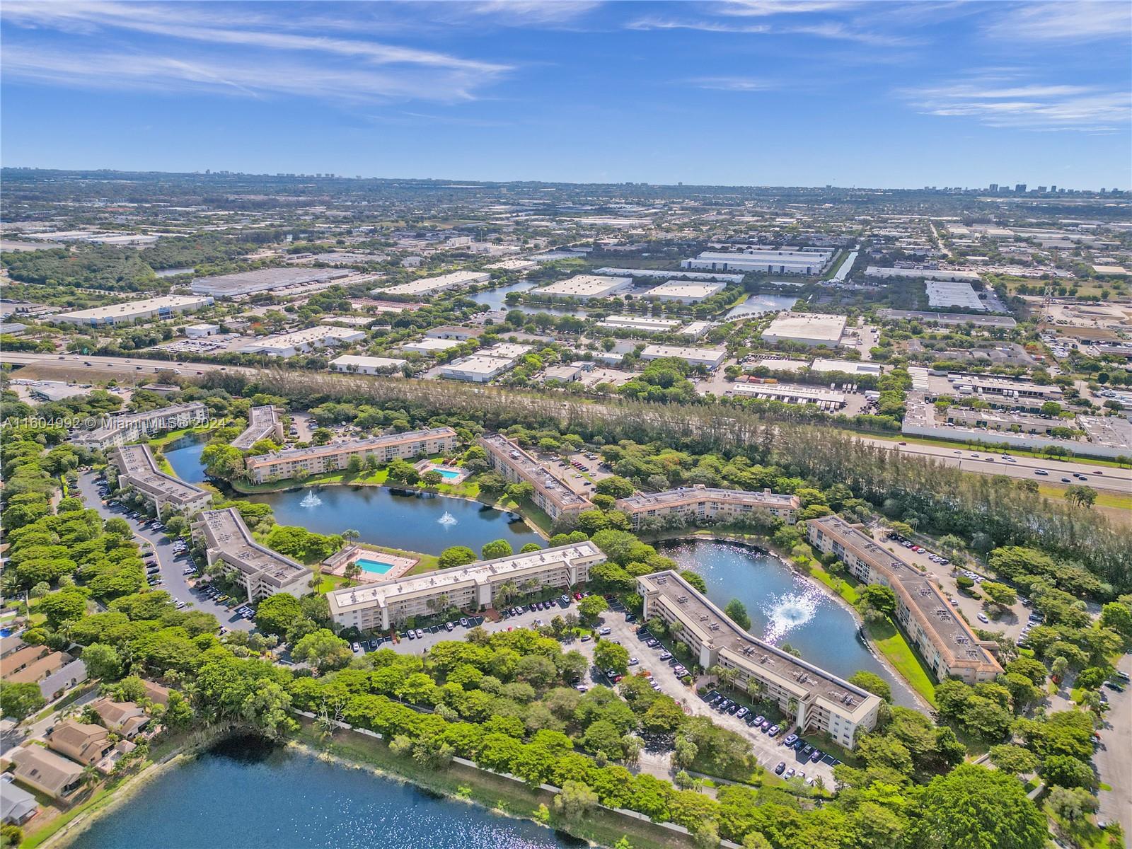 1802 Eleuthera Point, Unit E3 Coconut Creek, FL 33066 - Photo 73 of 78 an aerial view of residential building and lake
