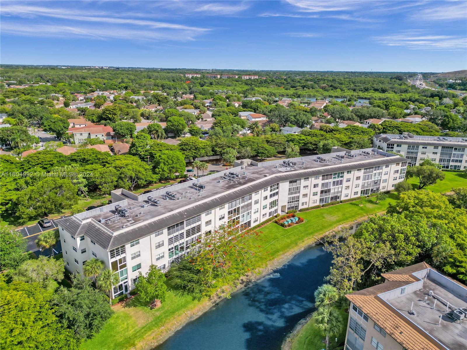 1802 Eleuthera Point, Unit E3 Coconut Creek, FL 33066 - Photo 74 of 78 a view of a city with a lake