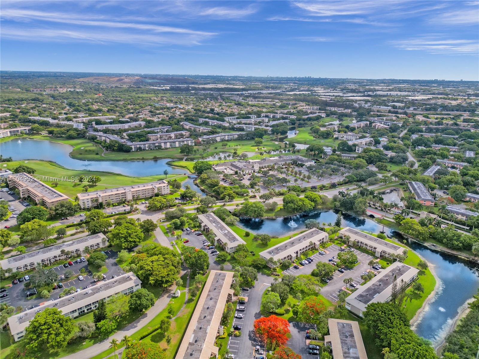 1802 Eleuthera Point, Unit E3 Coconut Creek, FL 33066 - Photo 75 of 78 an aerial view of residential houses with outdoor space