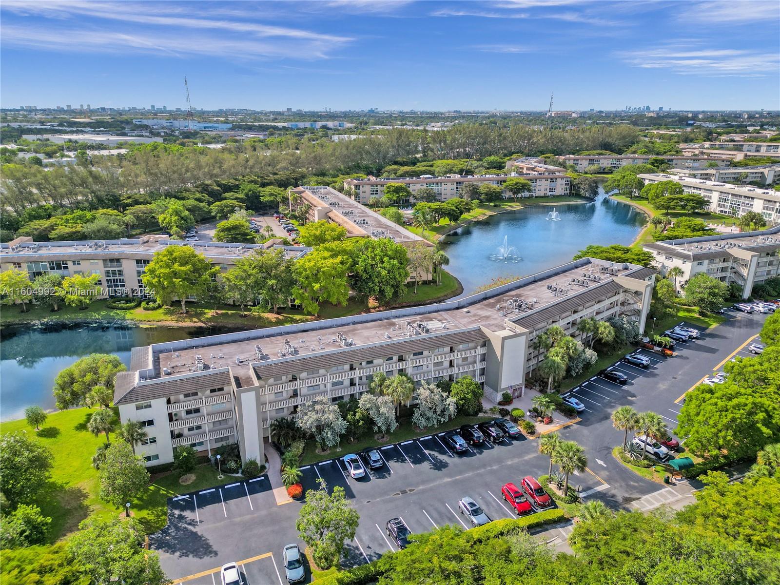 1802 Eleuthera Point, Unit E3 Coconut Creek, FL 33066 - Photo 76 of 78 an aerial view of a house with a garden