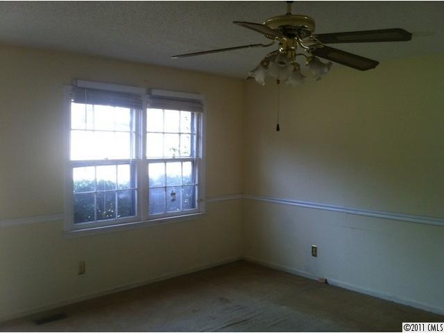 4104 Sterling Road Gastonia, NC 28056 - Photo 3 of 9 an empty room with a window