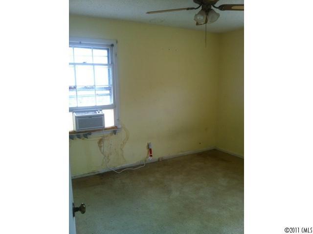 4104 Sterling Road Gastonia, NC 28056 - Photo 4 of 9 a room with a window and a ceiling fan