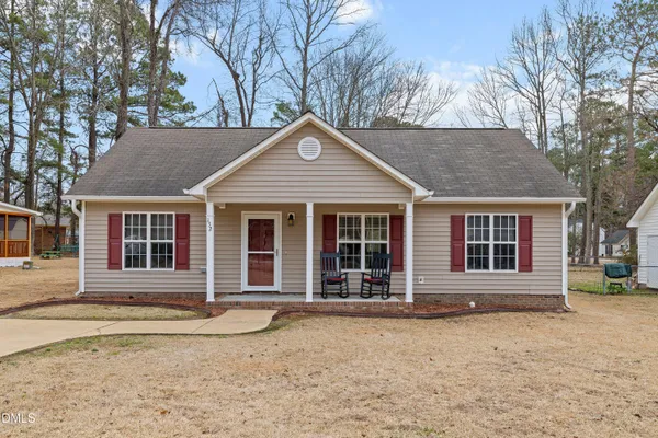 front view of a house with a yard