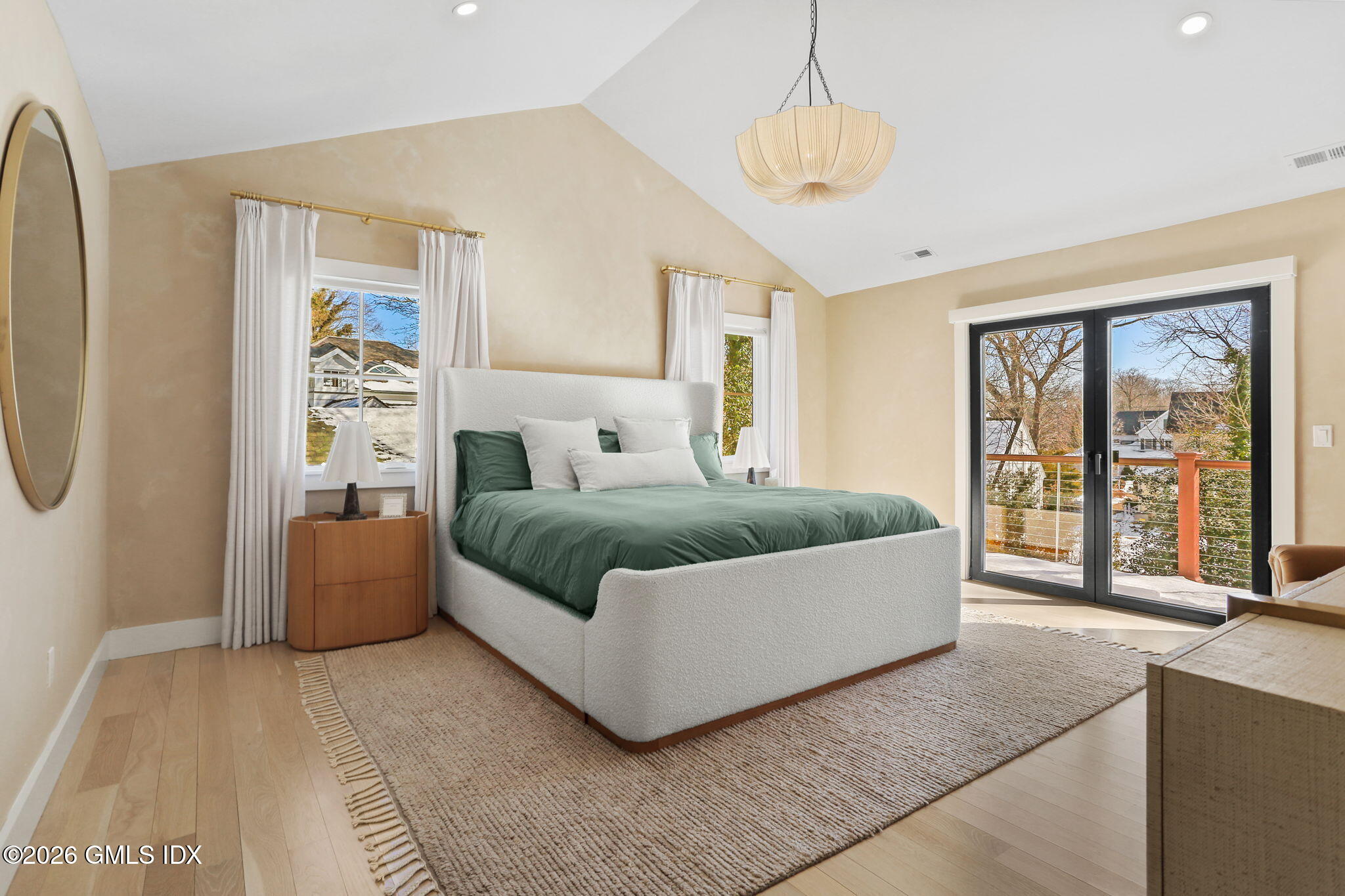 10 Lockwood Road Riverside, CT 06878 - Photo 19 of 38 a bedroom with a large bed and a chandelier