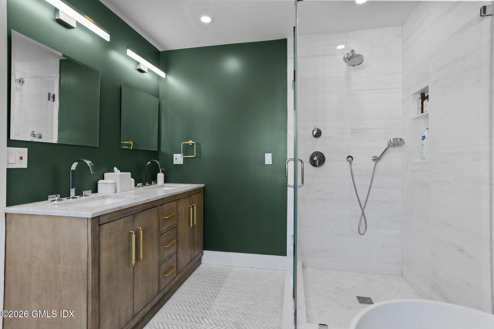 10 Lockwood Road Riverside, CT 06878 - Photo 22 of 38 a bathroom with a shower sink and mirror